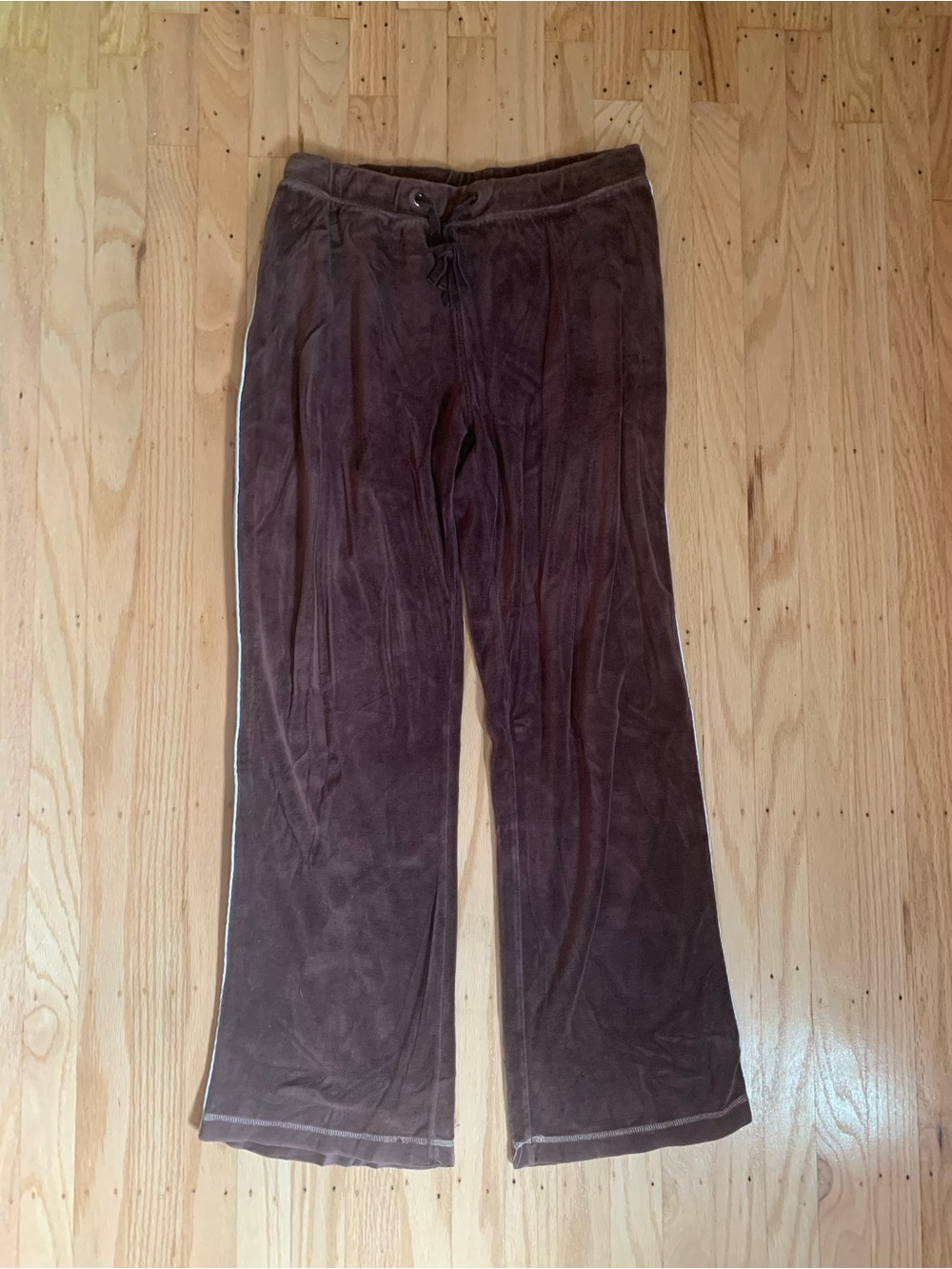 Brown velour sweatpants with white side stripes